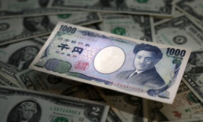 Yen beneath power as BOJ helps to keep charges secure