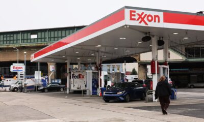 Exxon profits beat, will increase fourth-quarter dividend